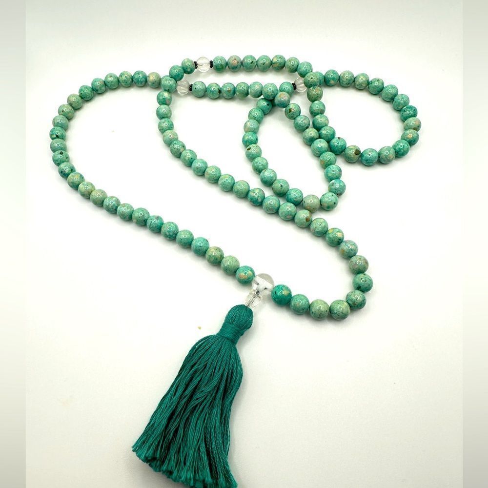 36" of composite‎ stone, 9mm beaded necklace with teal tassle!